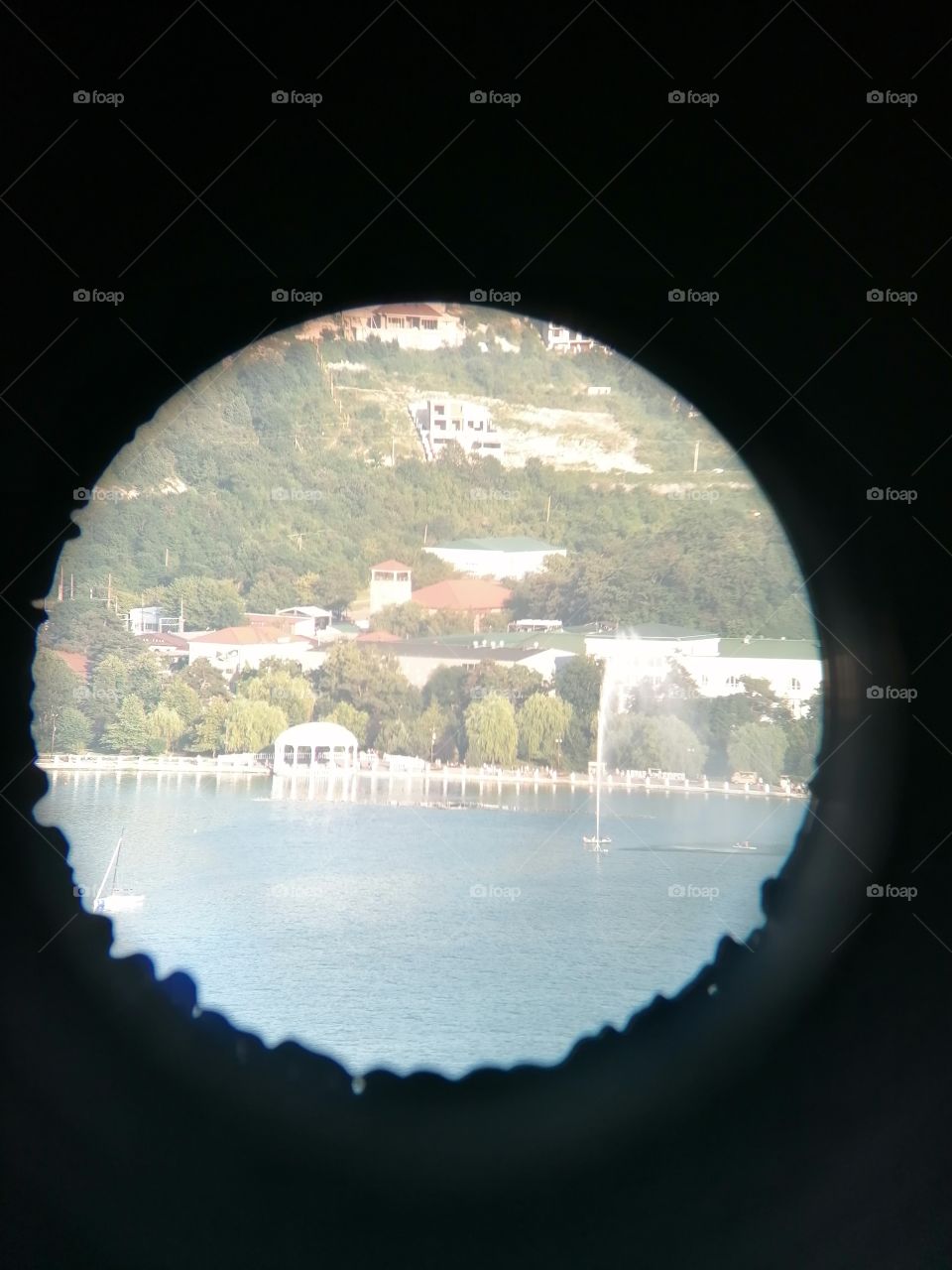 Abrau-Dyurso village, observation deck, photo taken through stationary binoculars, view of the embankment.