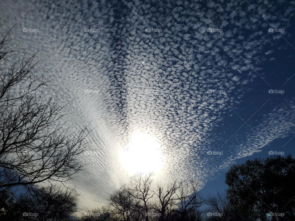 White in the sky
Way up high 
A mesmerizing sky