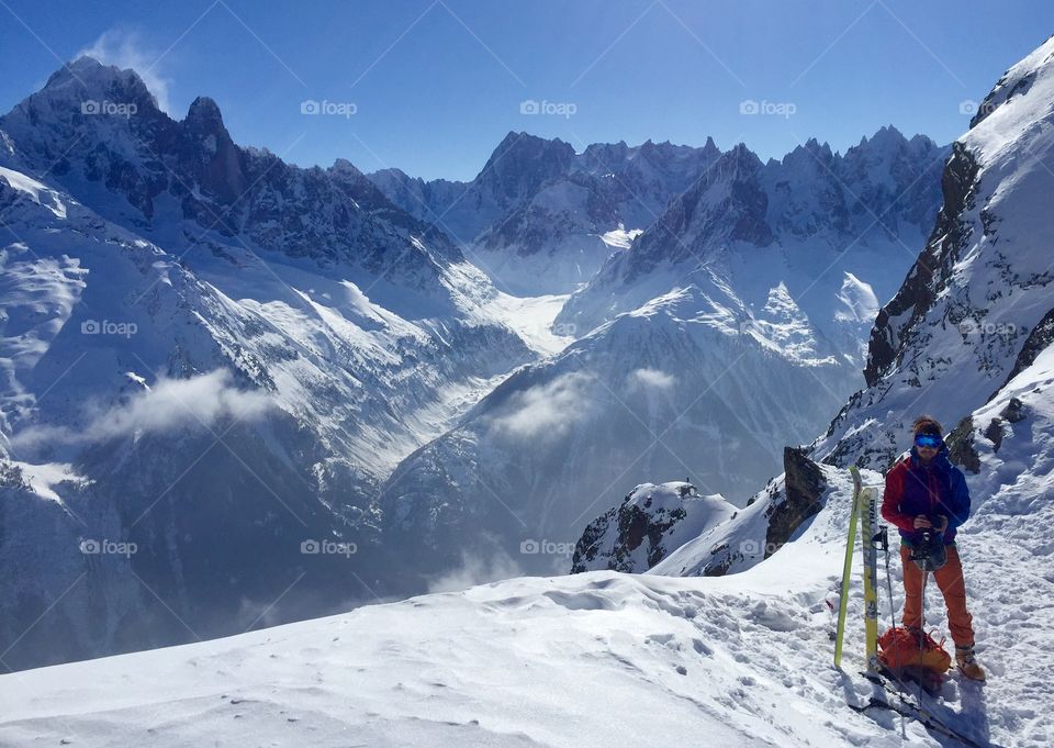 Ski touring above Chamonix in the alps on a beautiful winters day. 