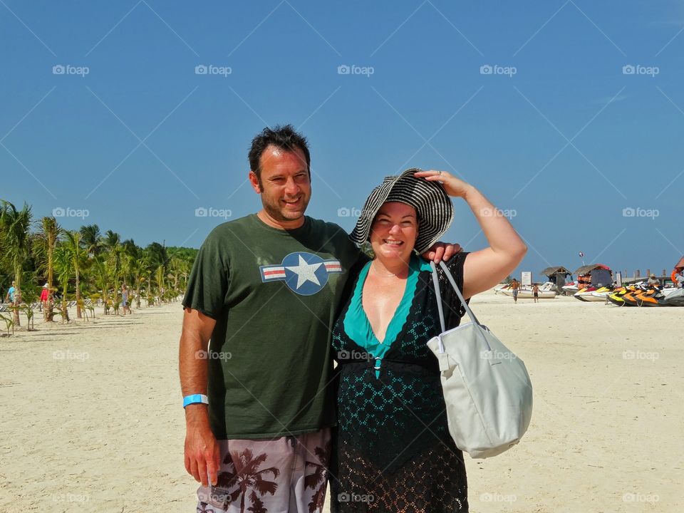 Americans Abroad. American Married Couple Vacationing On A Tropical Beach
