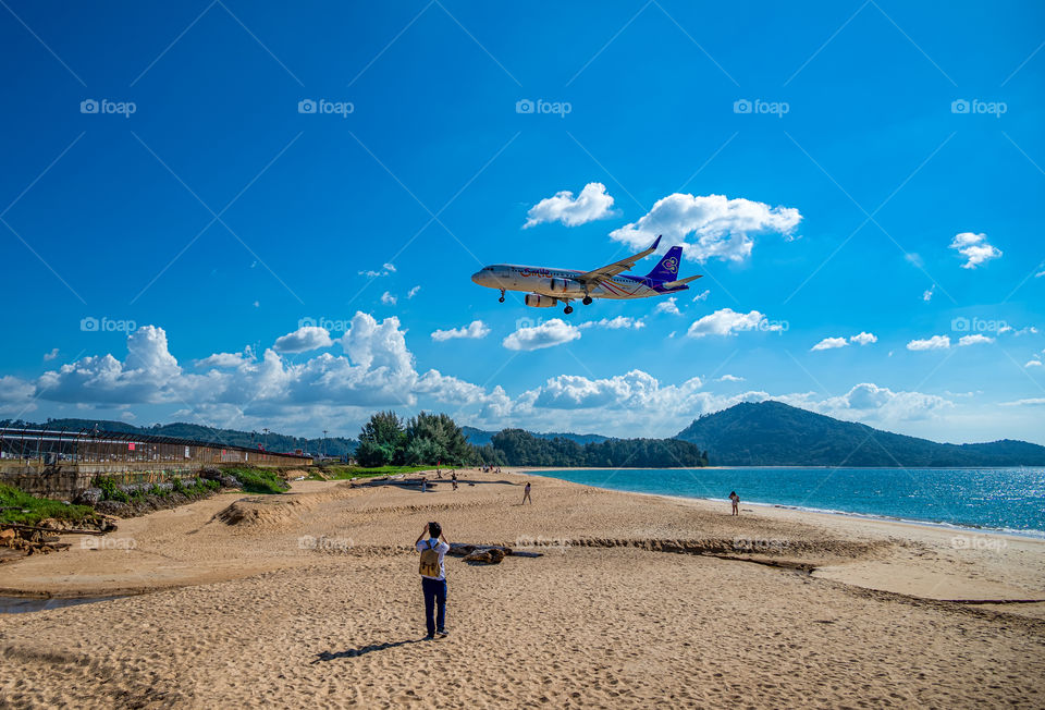 Air plane landing in the beautiful sea scape view in the southern of Thailand