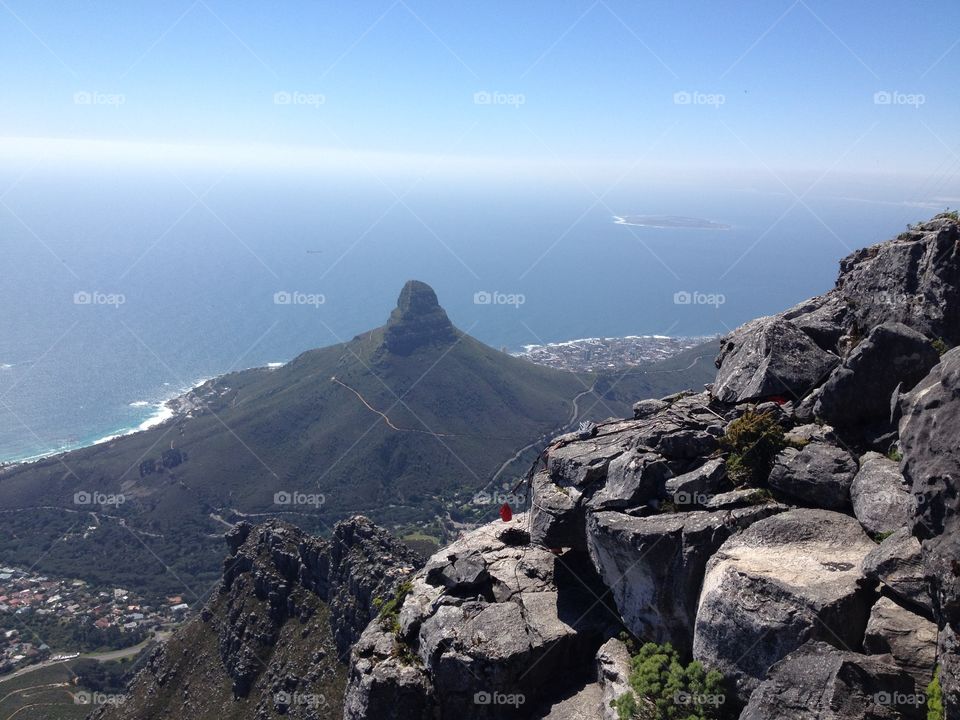 Lion's Head is a mountain in Cape Town, South Africa, between Table Mountain and Signal Hill. Lion's Head peaks at 669 metres (2,195 ft) above sea level. The peak forms part of a dramatic backdrop to the city of Cape Town and is part of the Table Mountain National Park.
