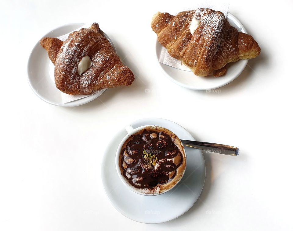 Cappuccino with chocolate and croissants