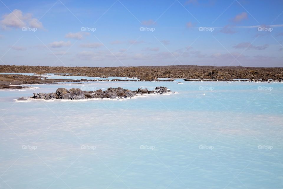 Blue lagoon on iceland against blue sky