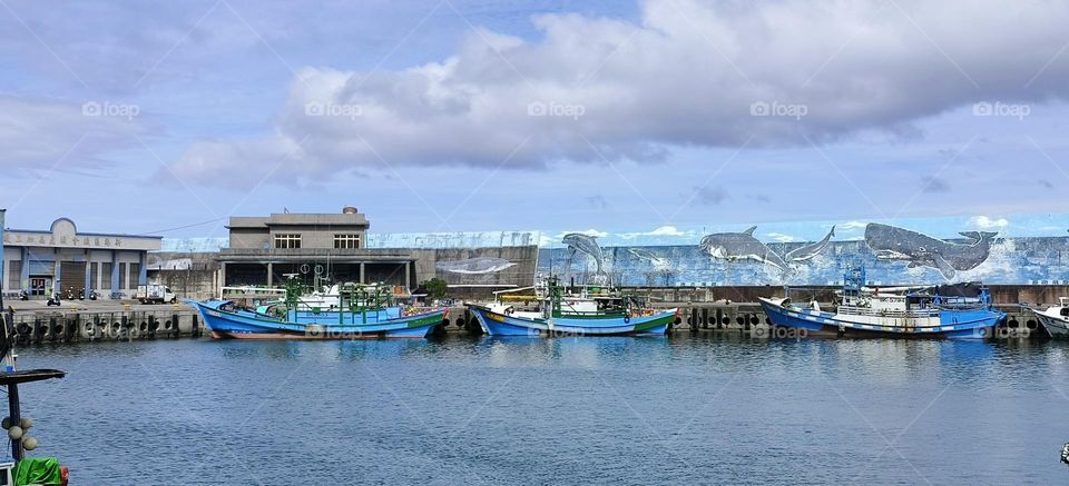 boats moored in fishing port