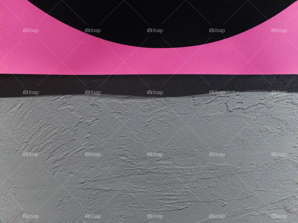 Pink minimalist poster detail over grey plastered background wall 01