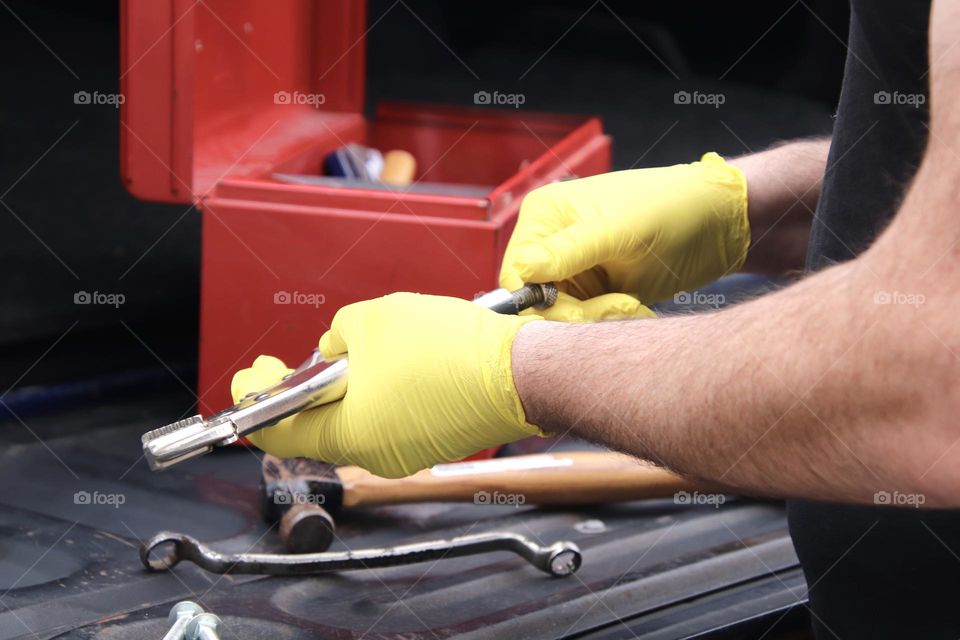 Mechanic working with tools up close view