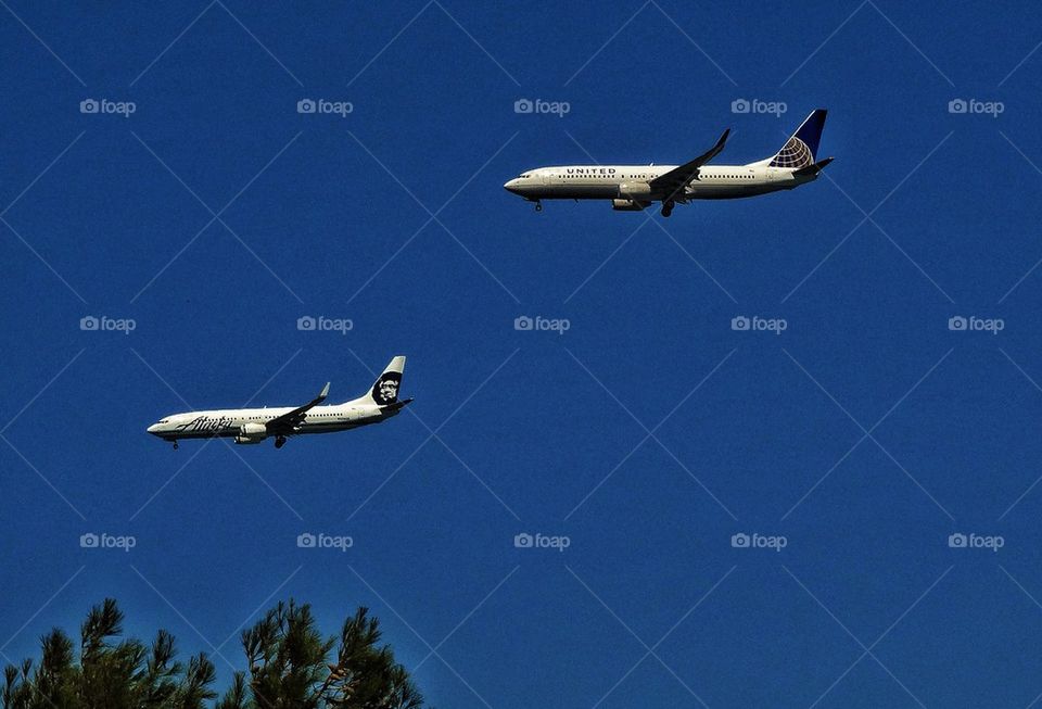 Two passenger jets landing at an airport