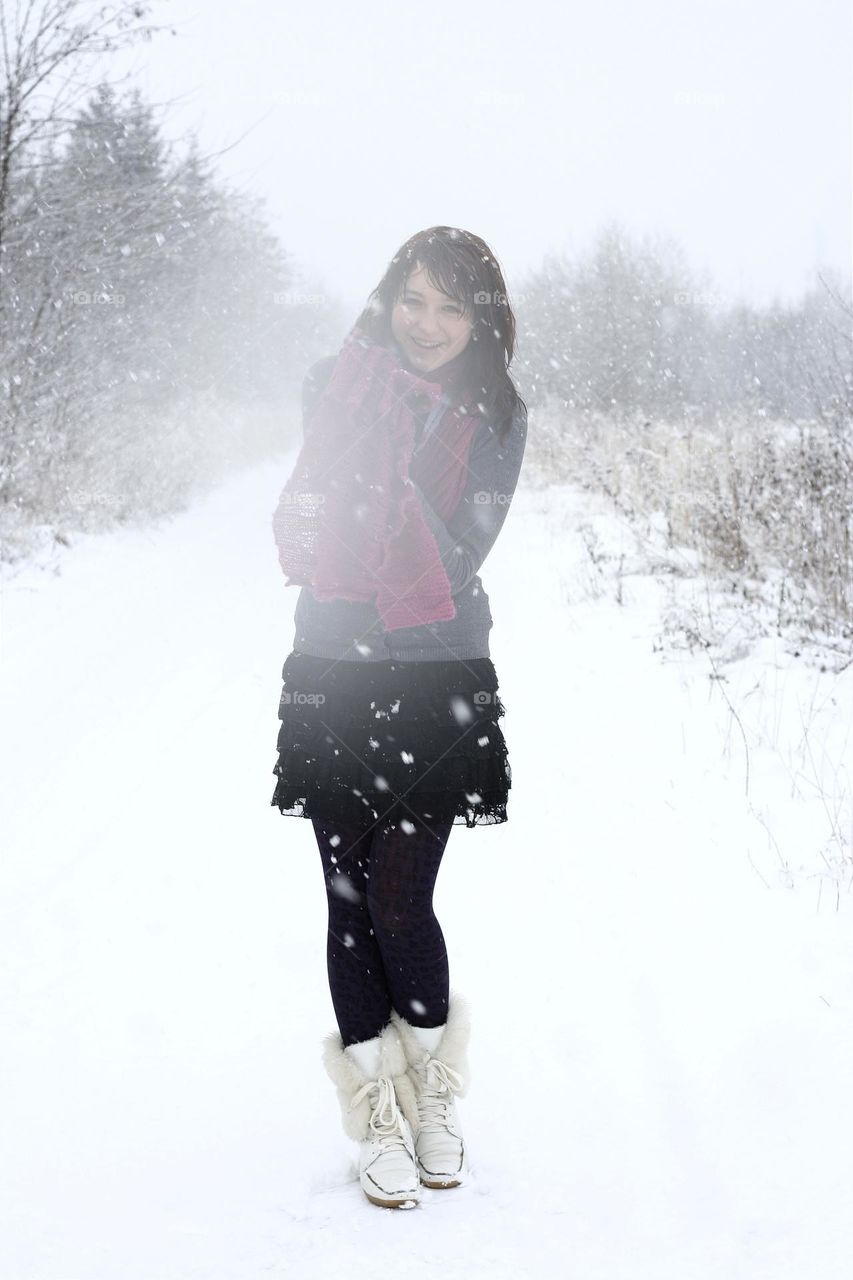 portrait of a smiling girl who loves Winter very much