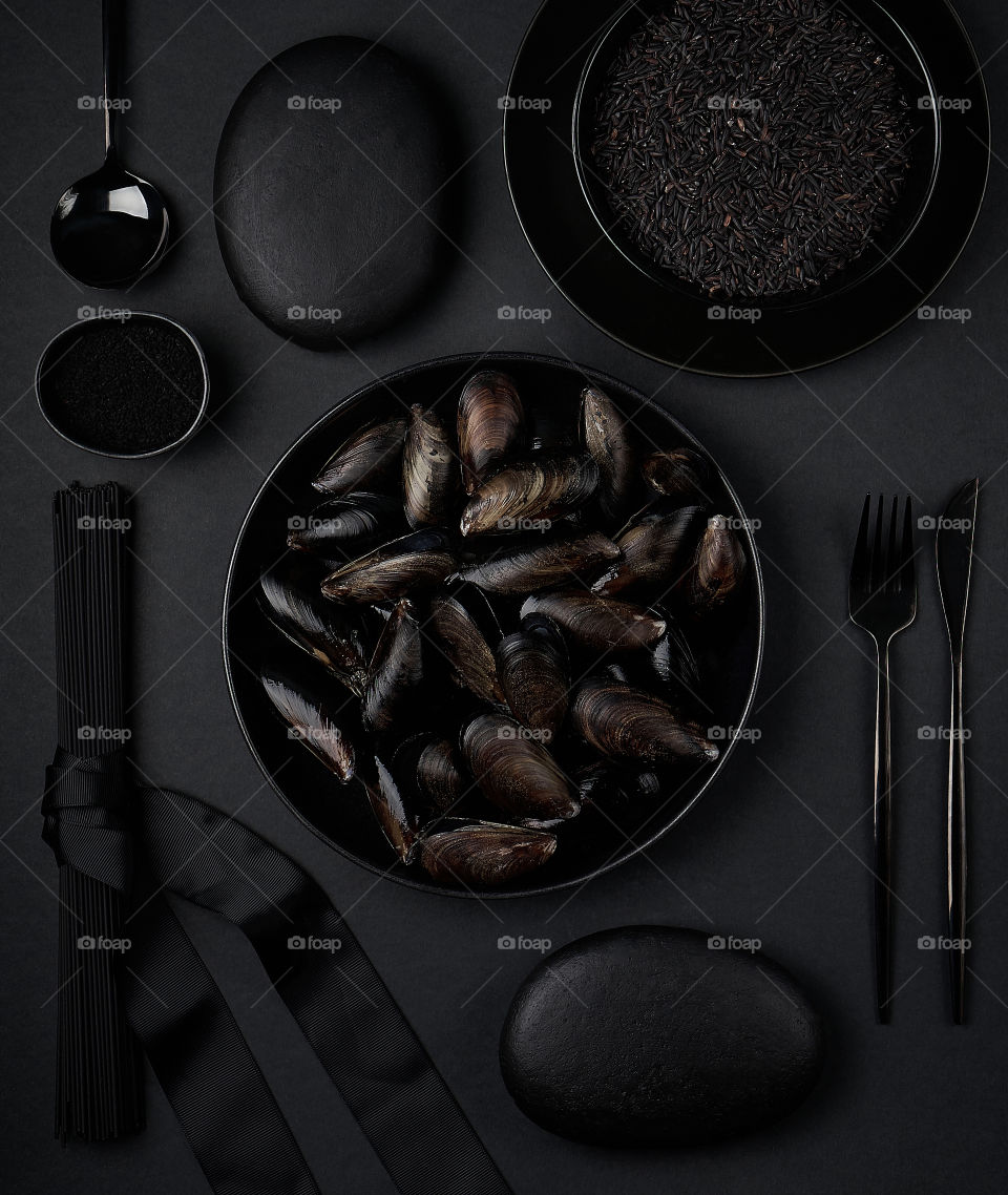 Black food and dishes flat lay