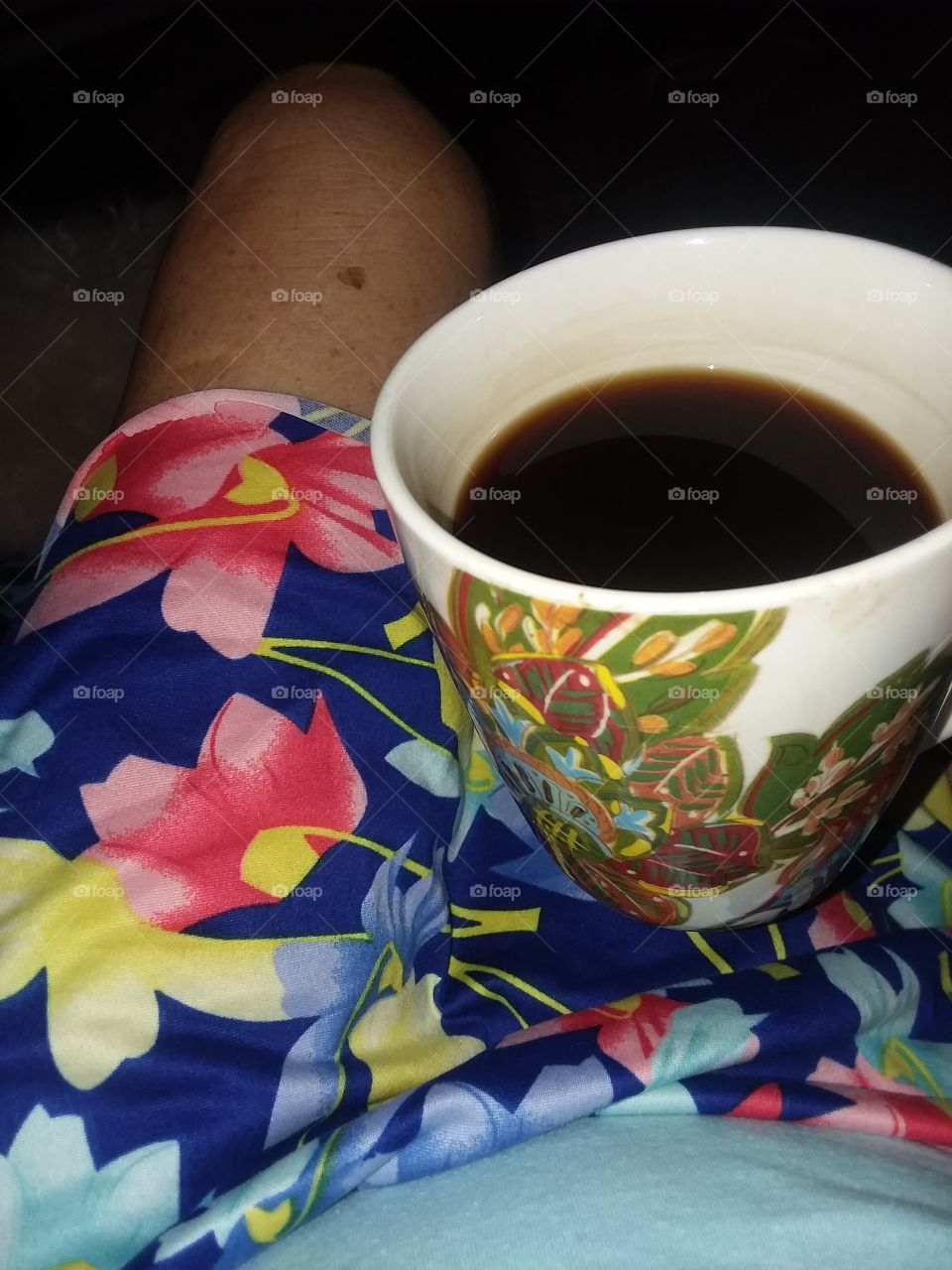 first cup of coffee of the day in dark in the cool morning breeze before the sun comes up