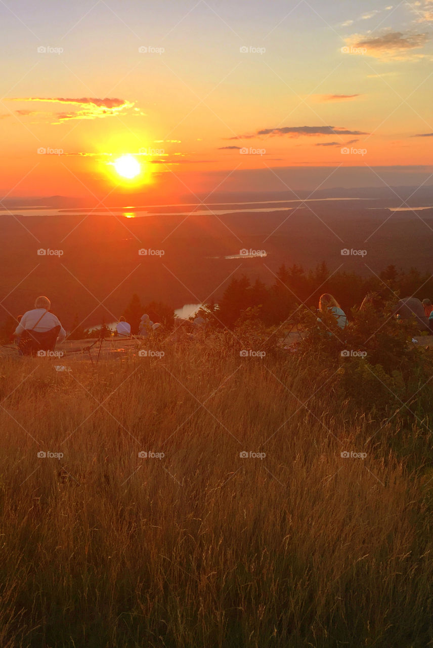 Magnificent and colorful sunset fro the top of Mount Cadillac, Mount Desert Isle, Maine! This is where you catch the first sunrise in the United States! 