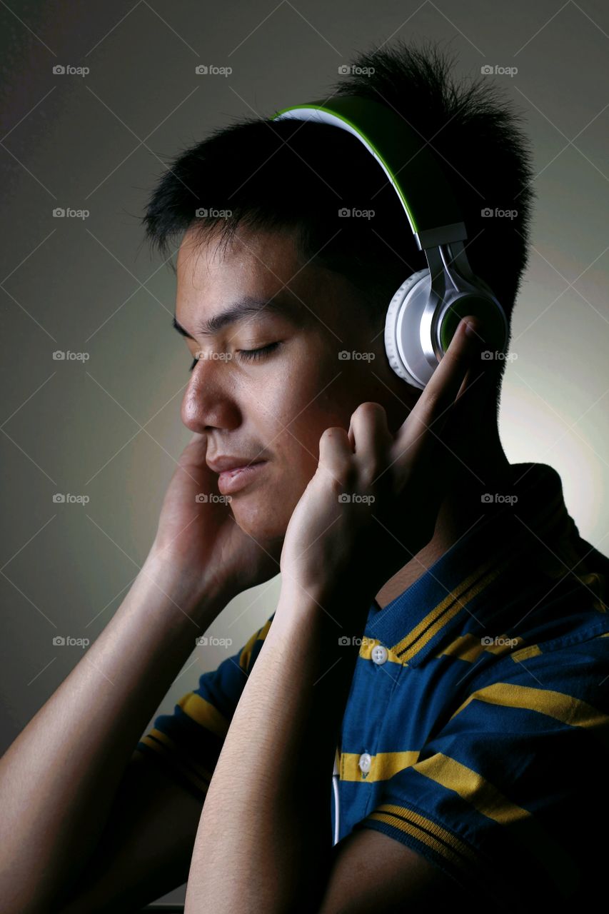 male teenager with headphones