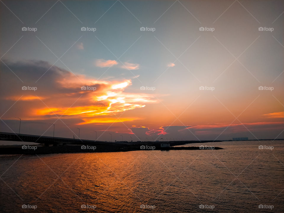 Sky, Ray, Sea, Bridge and Sunset at Pantai Indah Kapuk (PIK), Jakarta, Indonesia