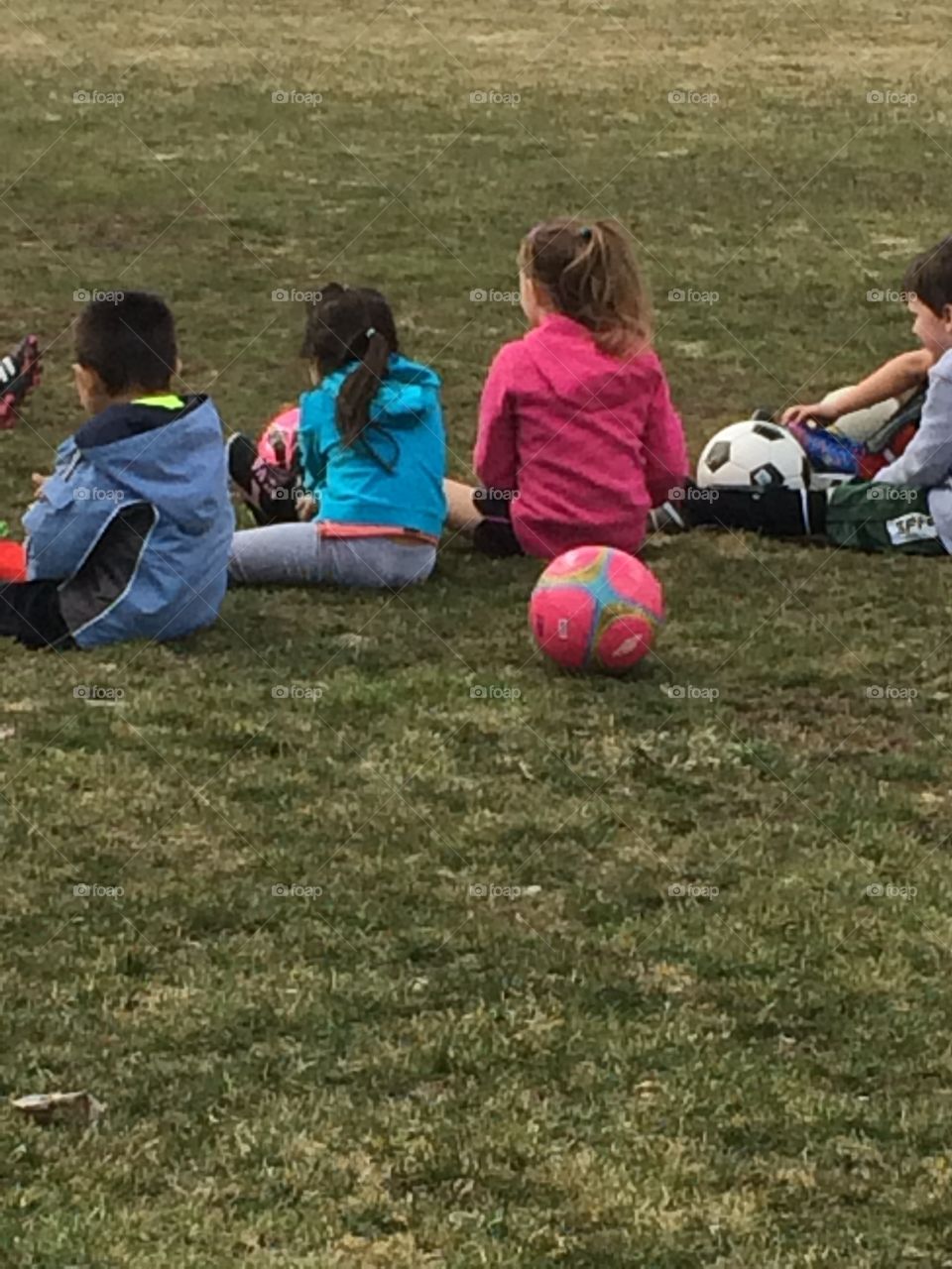 Children waiting for soccer practice 