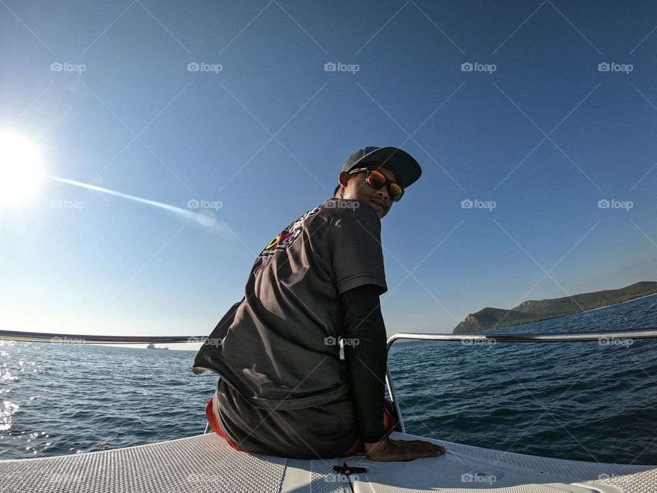 Sattahip,Chon Buri/Thailand-November 24 2019:Guide man of diving trip at Samae San island is sitting in front of the ship