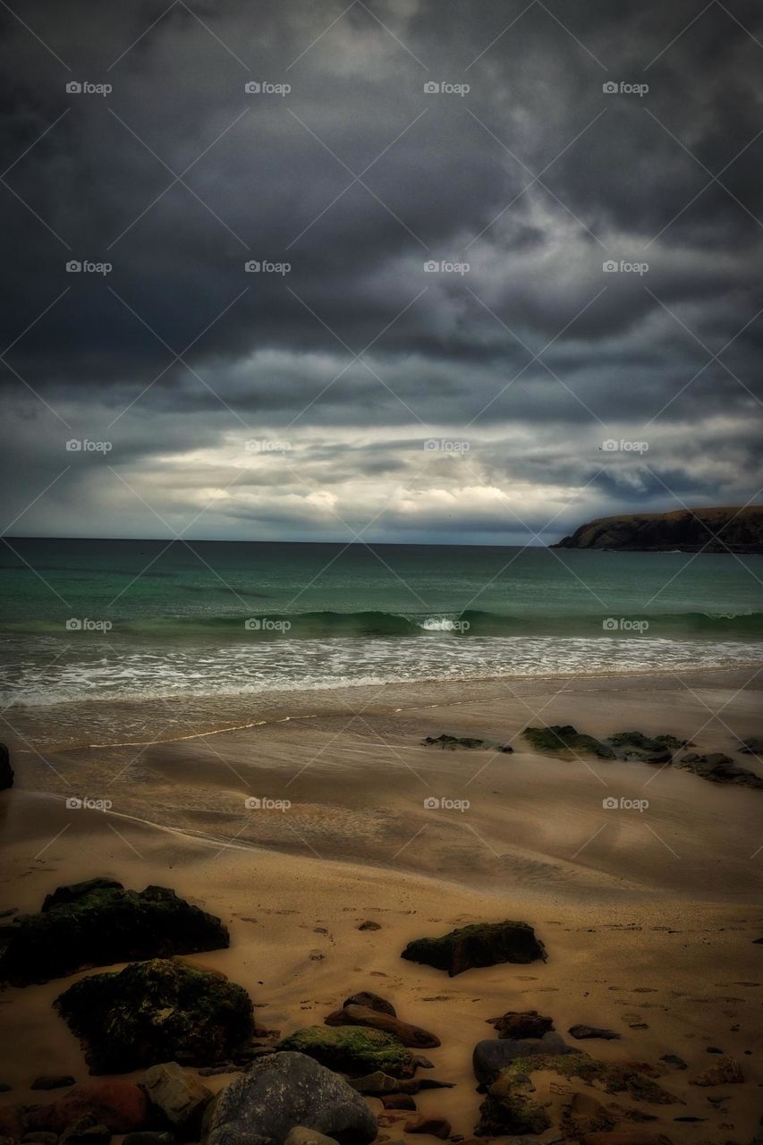 Beach in Scotland, moody beach picture, picture of a beach, sand and rocks on the beach, beautiful beach scene, stormy beach