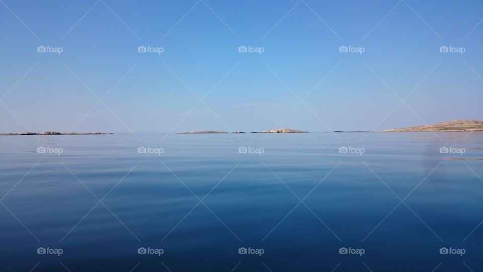 blue sky and sea. a calm warm summerday on a blue sea