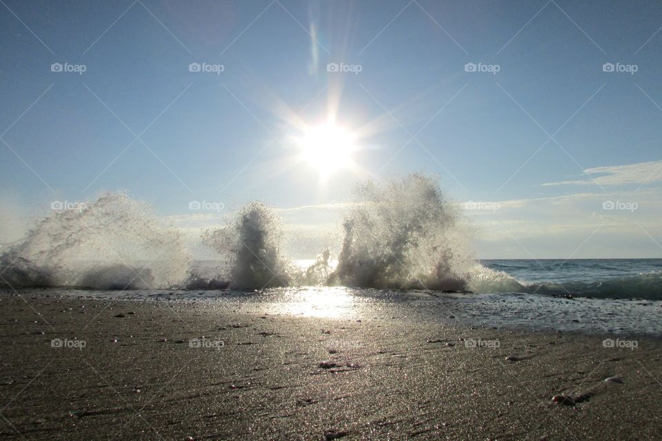 Amazing view of waves crashing against rocks at the beach in singer island Florida!