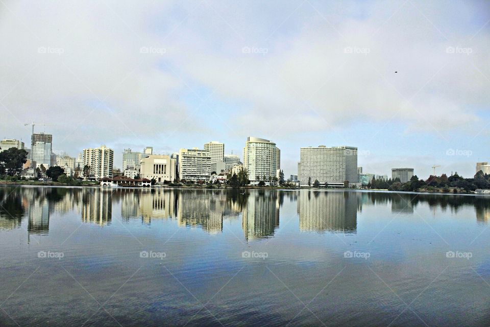 a architectural reflection off of Lake Merritt in Oakland California. photograph, photography, business trip,