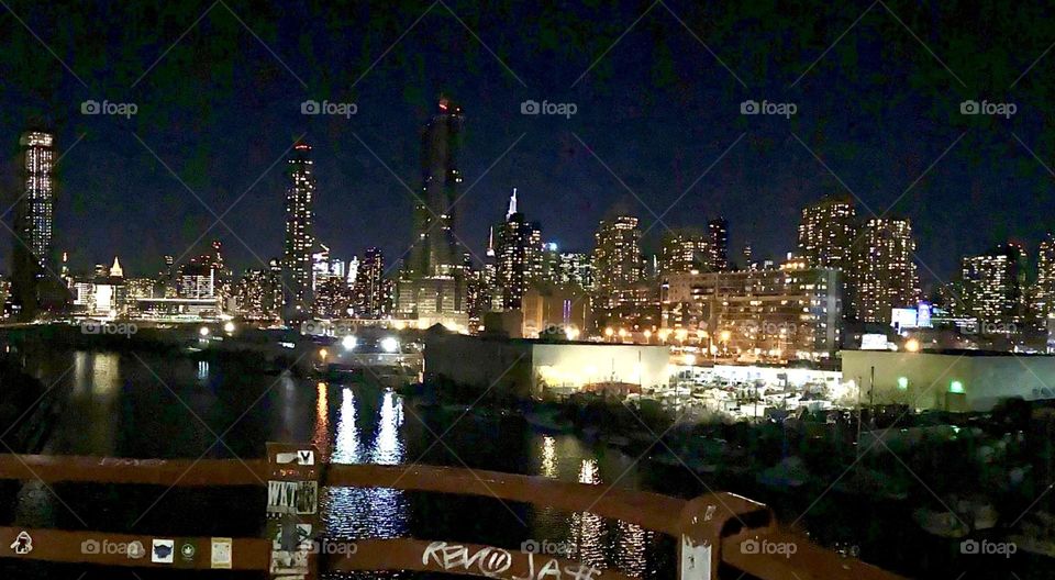 A closer perspective on the Long Island City, Queens and the Manhattan skyline behind it seen from the “Greenpoint”, Bklyn side of the “Pulaski Bridge”. 202/. Hypnotic Productions