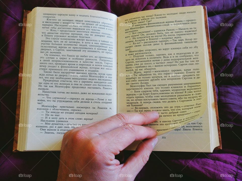 Hand leafing through a book