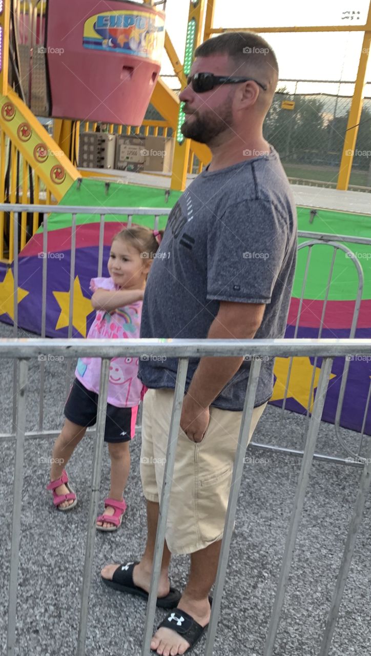 Waiting In Line To Go On A Carnival Ride