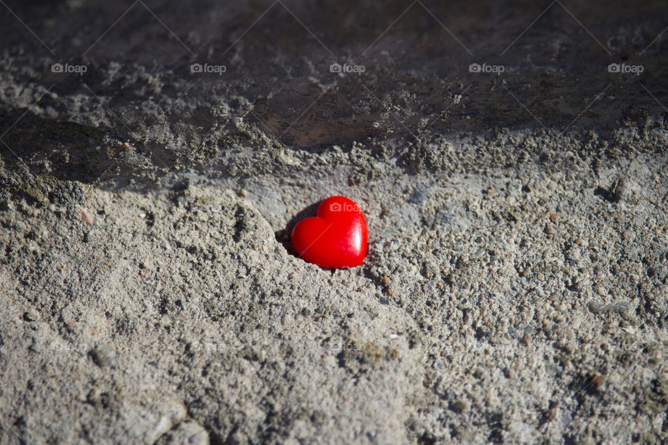 red heart on concrete background