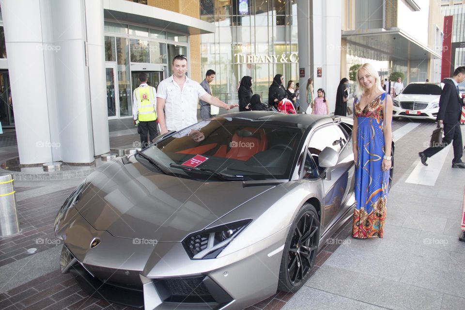 A Lamborghini sports car in a modern city in the parking lot.