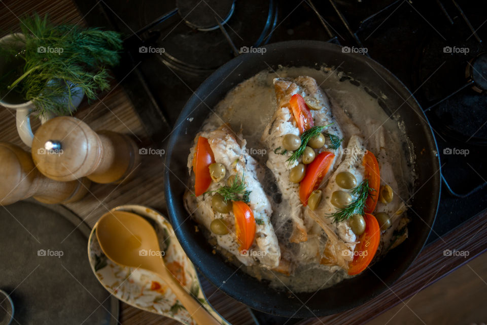 Dish with Sea bass fried with vegetables 