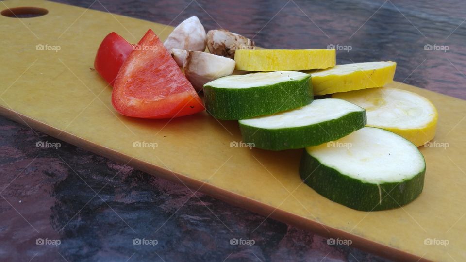green cucumber slices red bell pepper slices yellow squash slices and mushroom