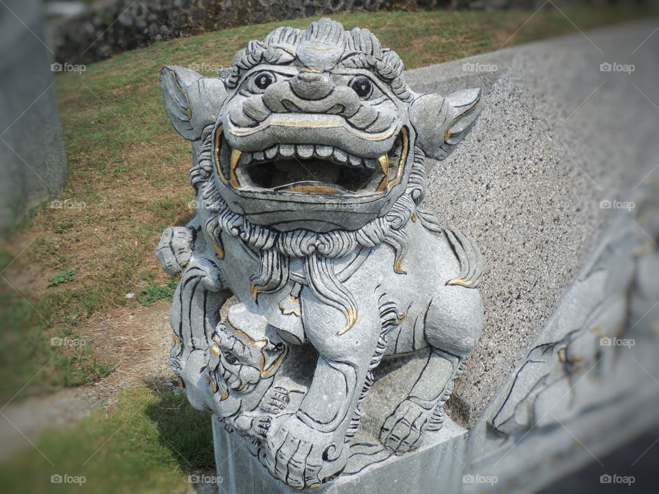 luon-shaped stone statue of fire