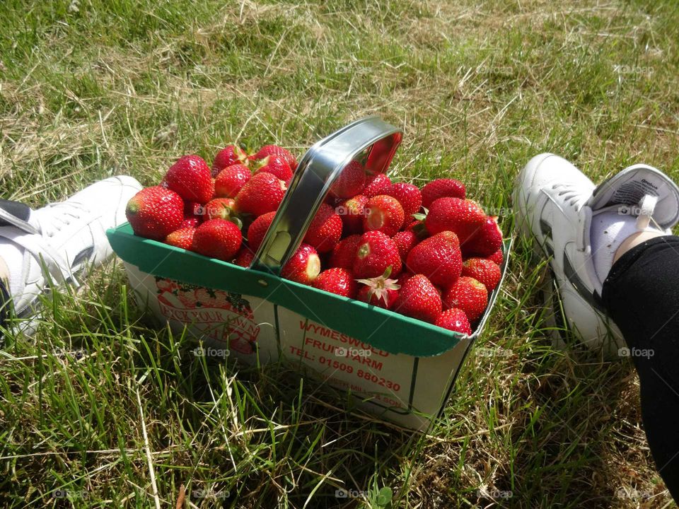 shoes and strawberry. brake after  harvesting of strawberries