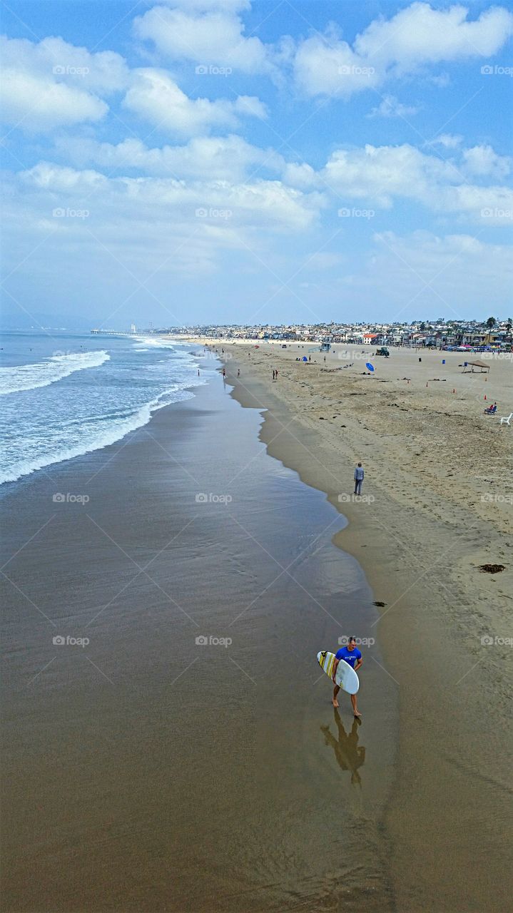 Tired Surfer. Surfer calling it a day after a morning of decent waves!