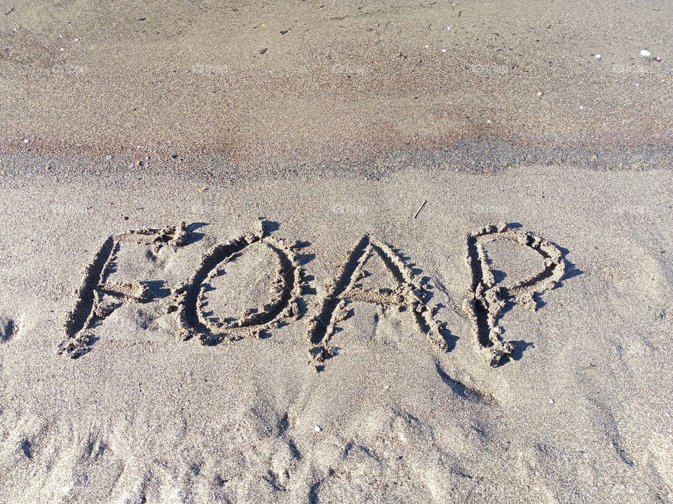 words written in beach sand