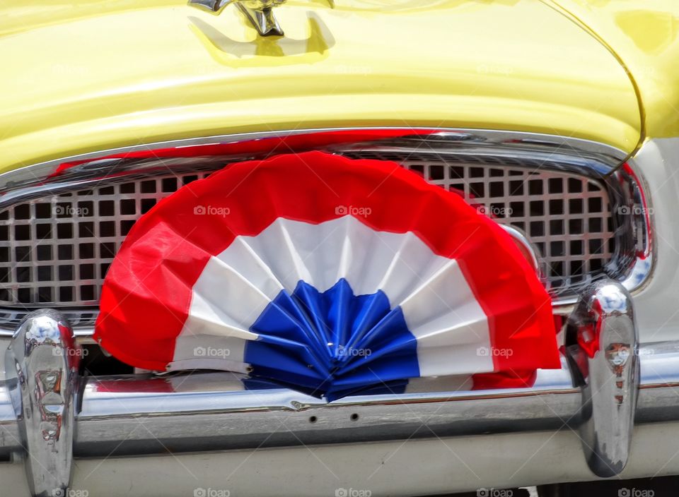 American Pride. American Flag Banner On A Car Grille
