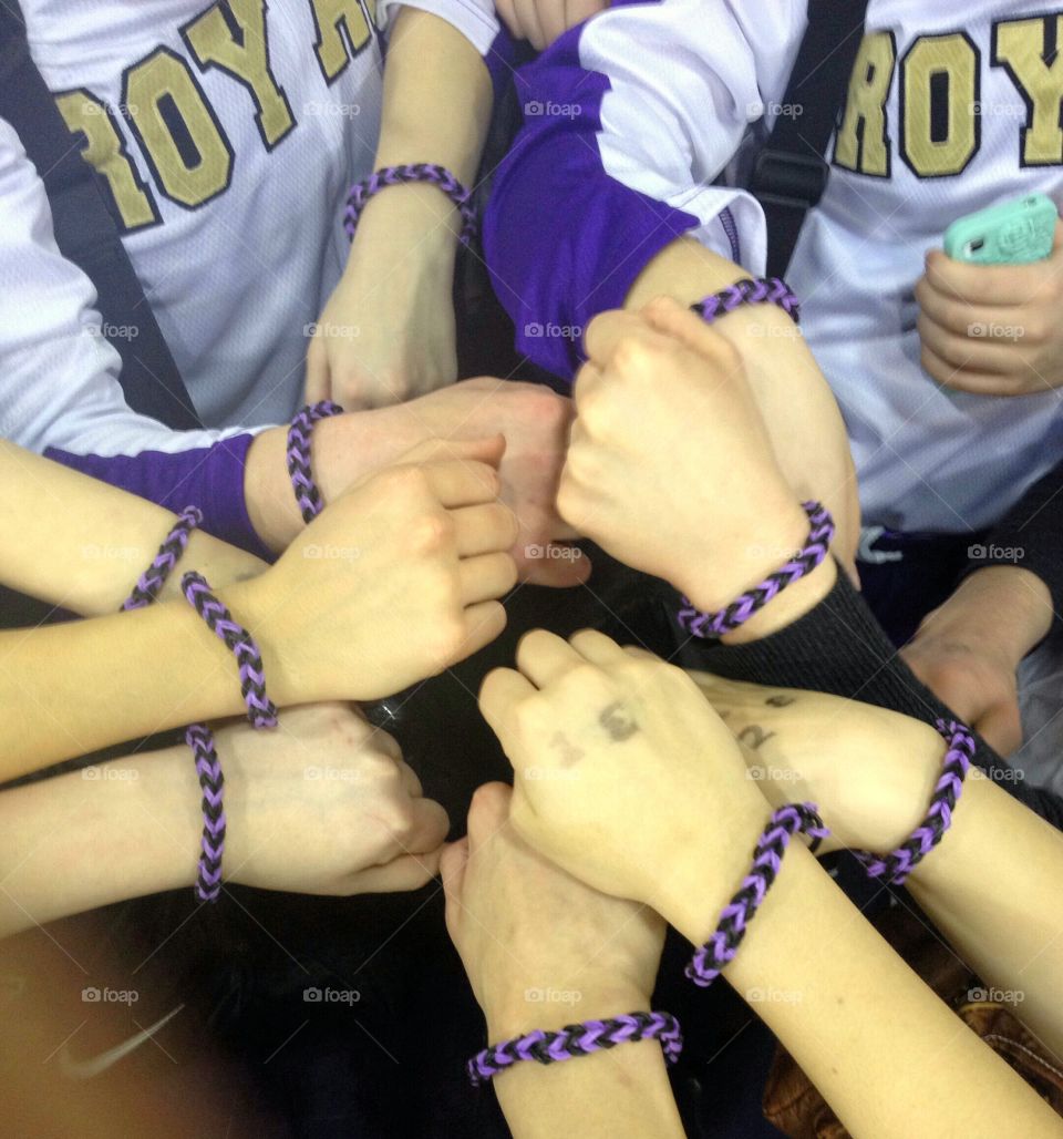 TEAM. The younger brother of one of the girls made the whole team bracelets for the State Tournament. So precious.