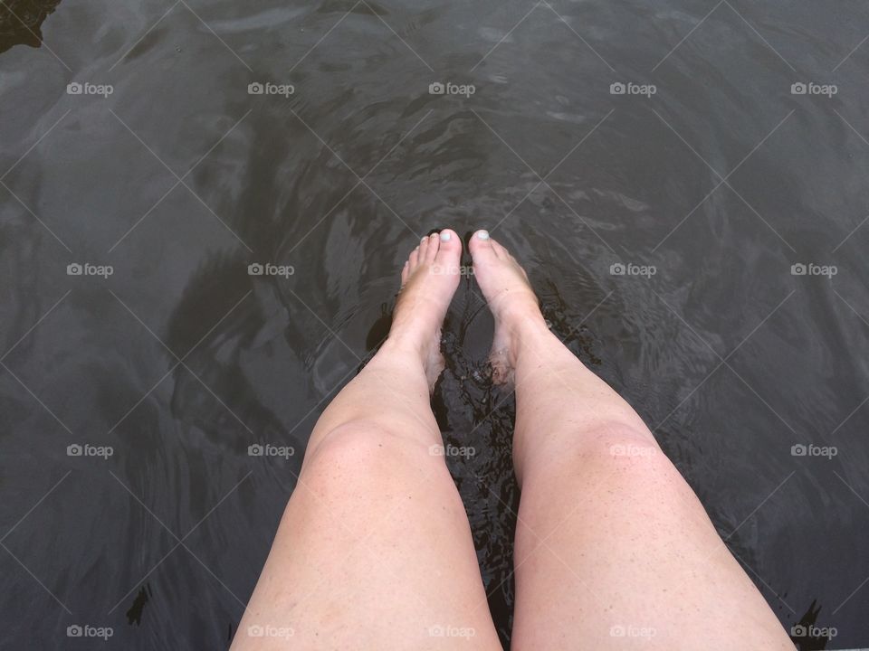 Legs in the river