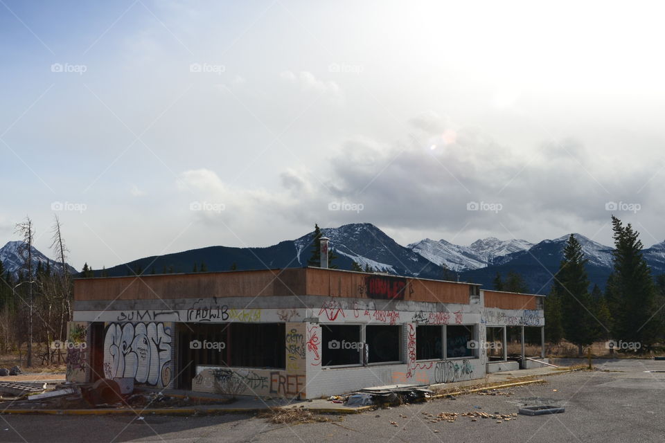 Abandoned building with graffiti in oddest place on highway on the way to Banff. 