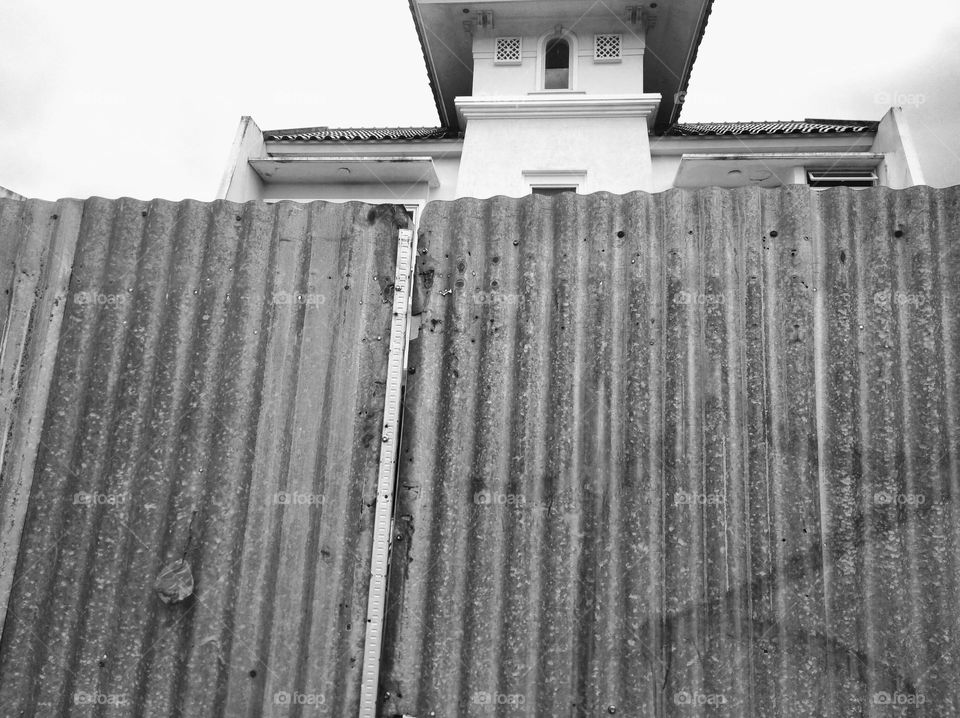 House with zinc fence