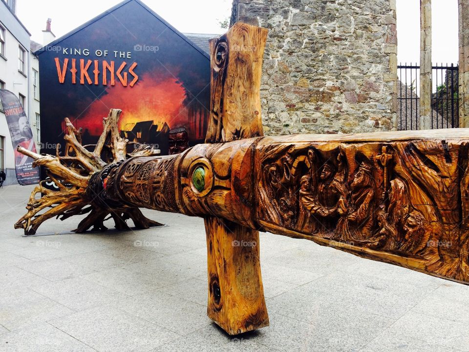 A carved wooden sculpture of a sword in the street of Waterford city in Ireland 