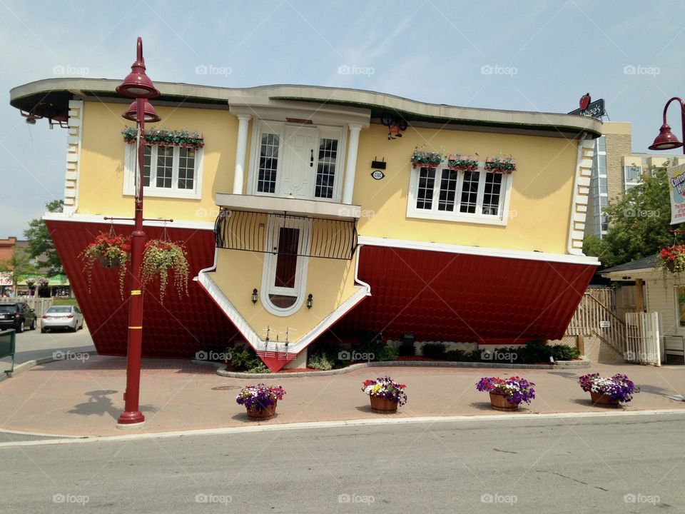 Yellow upside down house…