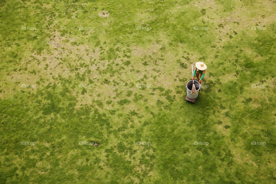 A person standing on grassy land
