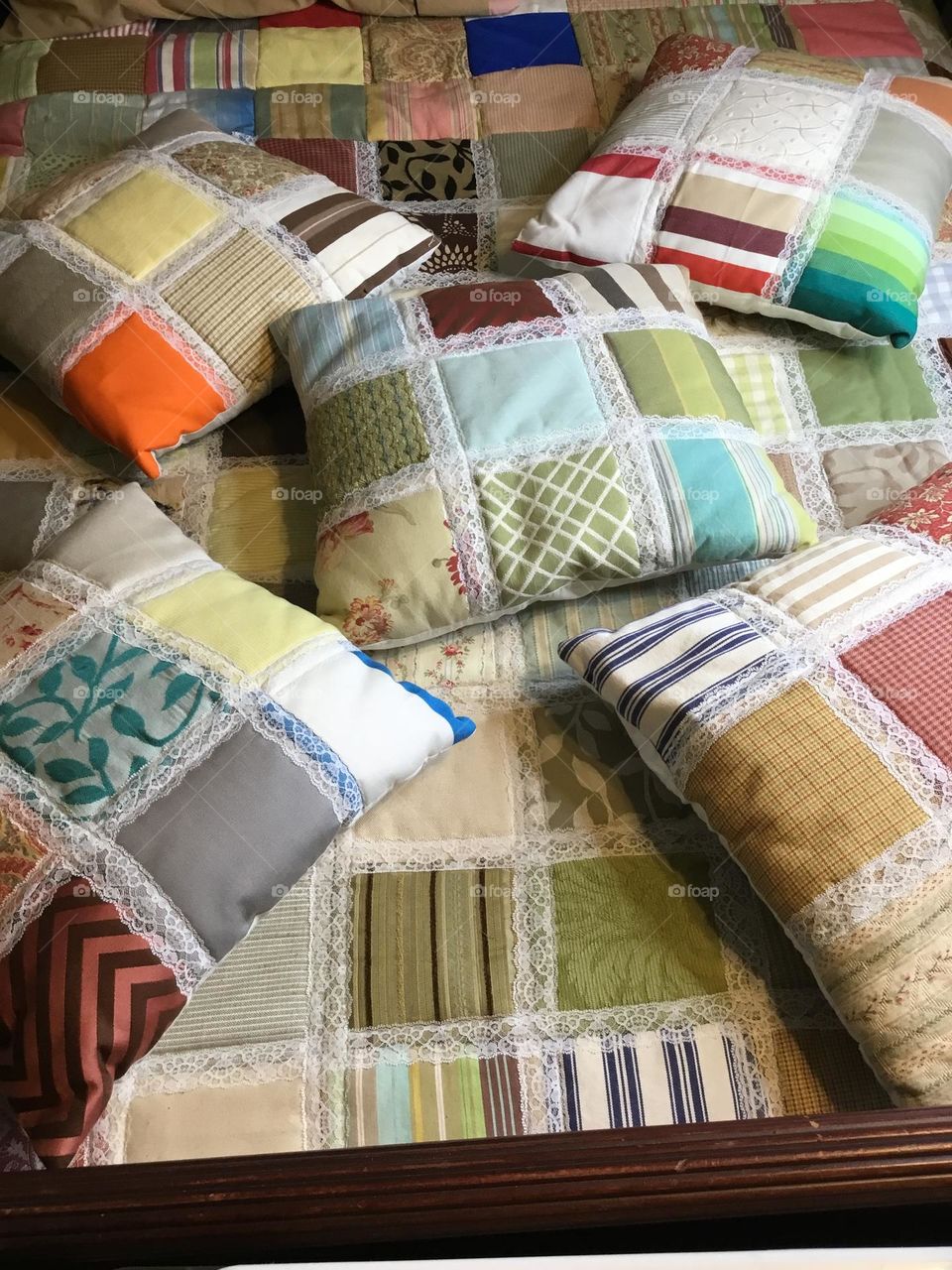 A patchwork pillow - The absolute star of this project is the beautiful patchwork design that is created using 4 – Four Patch blocks sewn together into a mini quilt top