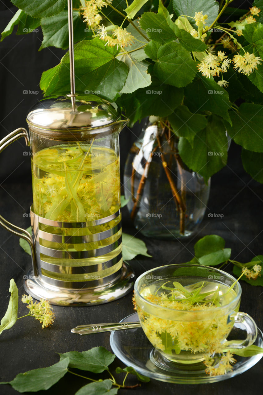 Close-up of green tea in cup and jug