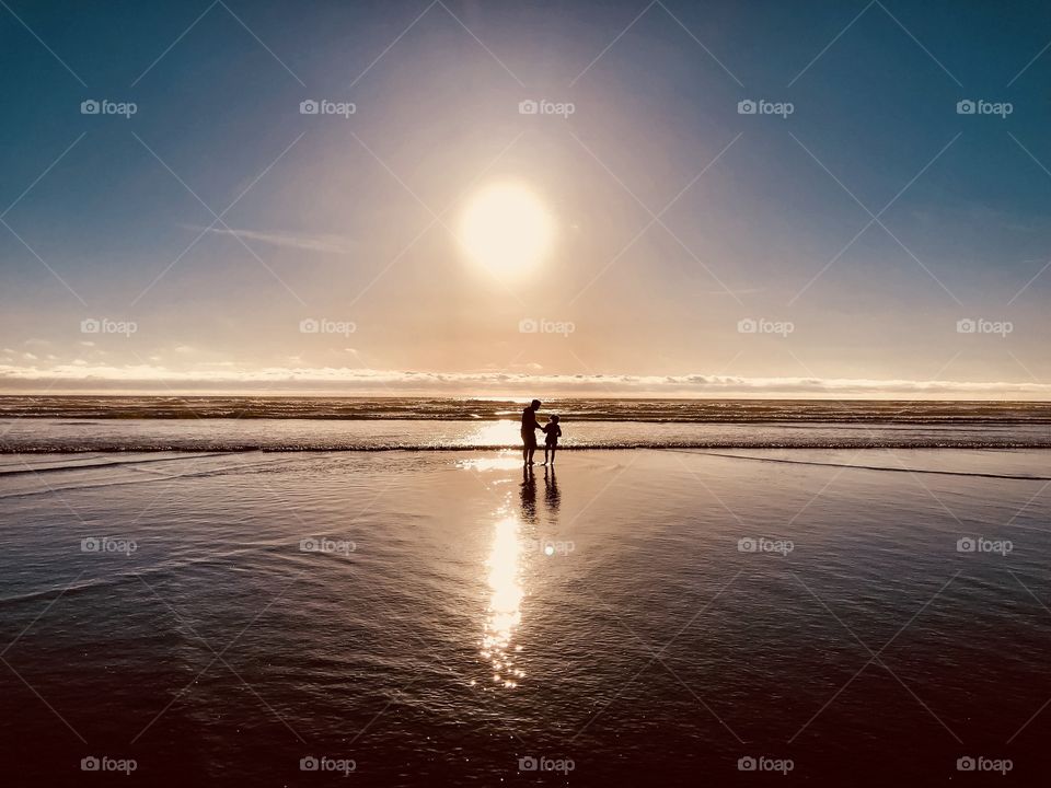 Summertime ... something as simple as a walk on a beach. Feel the water flowing beneath you. Feel the wind blowing your hair. See the sun as it dips below the sky line. Smell the salt in the water. Enjoy every little moment. Even the most simple ones