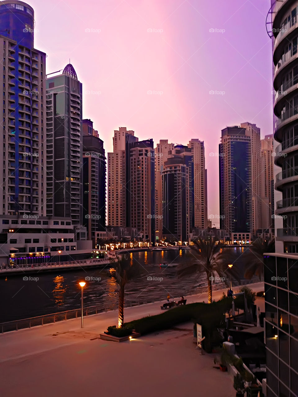 Beautiful purple sunset sky over the business center in Dubai marina 