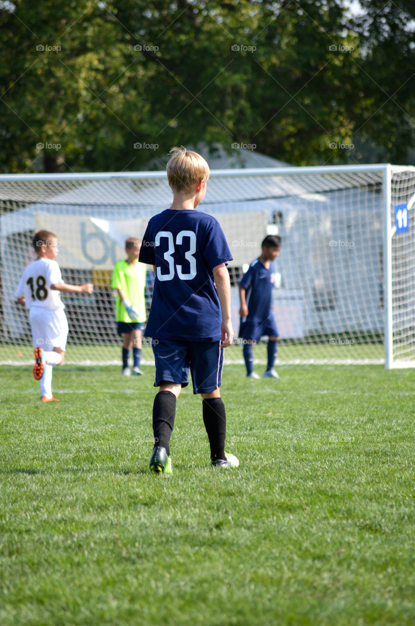 Boys playing a soccer game