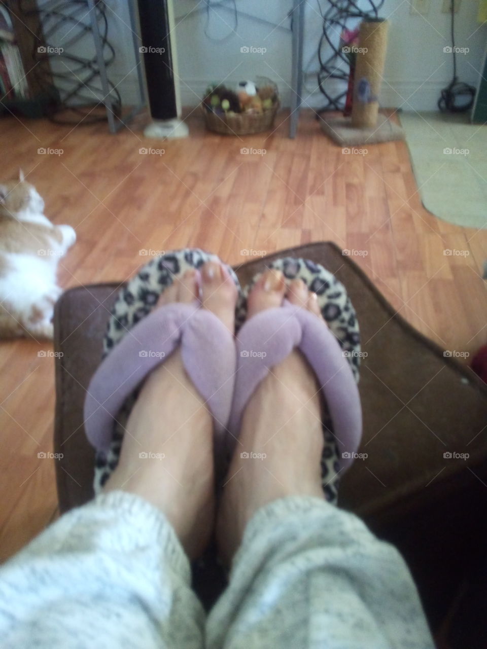 playing around with my feet. just put on my gold nail polish. oh look at those white legs blah.