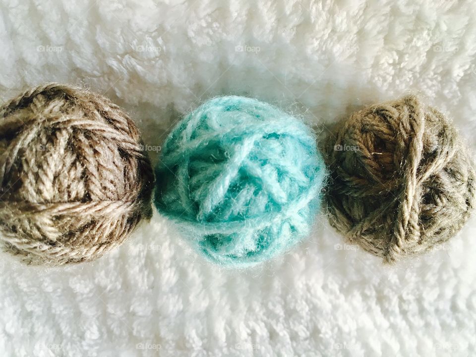 These are yarn balls . I thought they were beautiful macro shot models because they are colorful under a white background. 